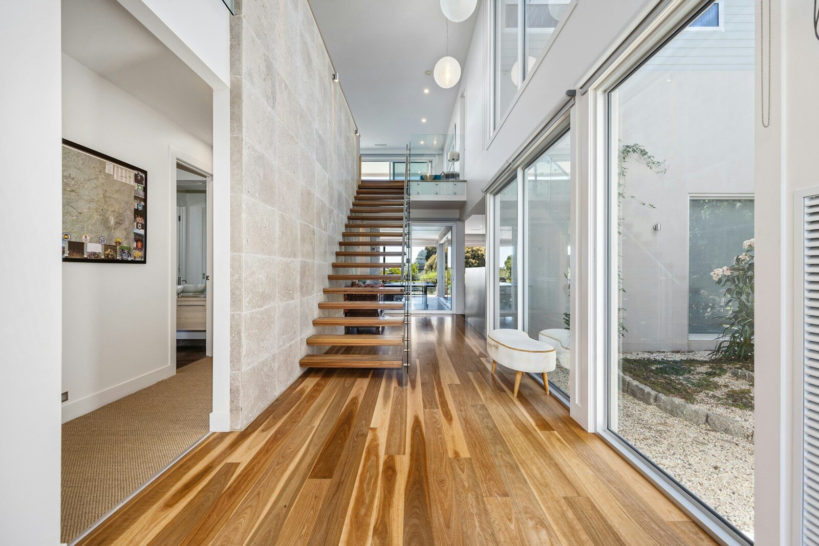 A wooden floor and stairs in a house